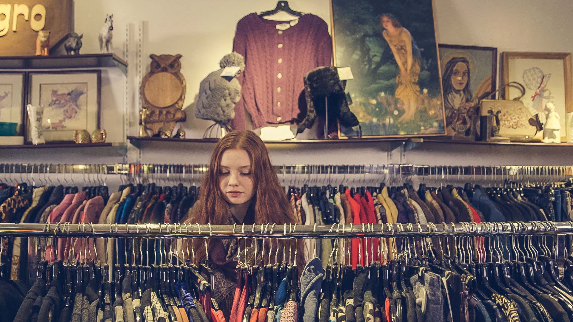 A woman in a vintage clothing boutique